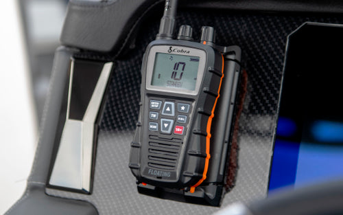 Cobra marine radio mounted to a boat dashboard